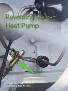 Heat pump reversing valve identified during HVAC inspection of a new-construction home in Central Florida by BAA Inspections.